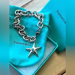 Tiffany and Co sterling silver starfish bracelet with turquoise accent.  7”.